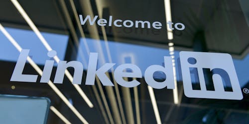 LinkedIn logo on glass door LinkedIn logo on glass door