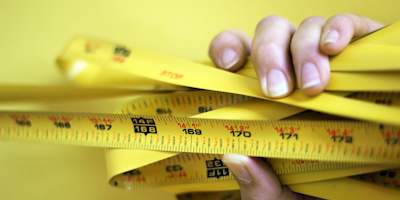 Measuring tape in person's hand