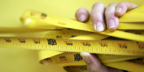 Measuring tape in person's hand