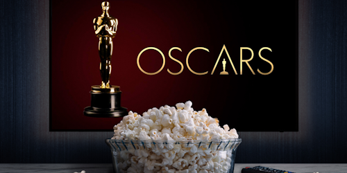 Oscars on TV with popcorn in bowl