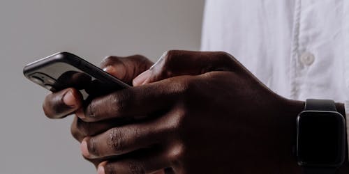 Man holding iPhone Man holding iPhone