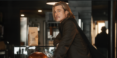 Brad Pitt standing at a counter