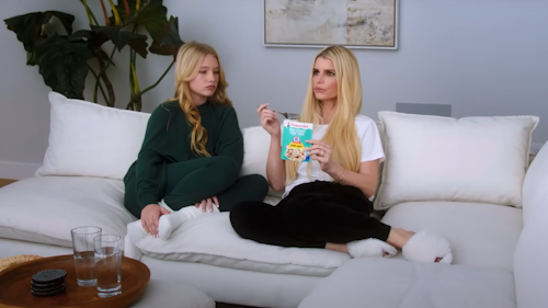Jessica Simpson and daughter Maxwell sitting on white couch eating Chicken of the Sea tuna packet