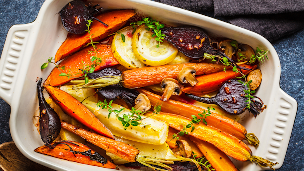 Casserole tray full of fall vegetables and carrots