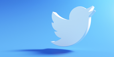 Twitter logo floating against blue background