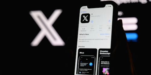 X app on mobile phone display