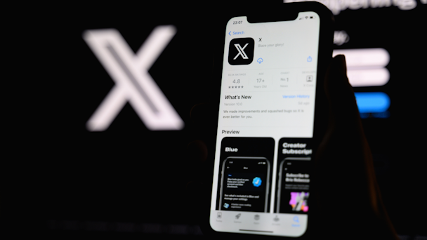 X app on mobile phone display