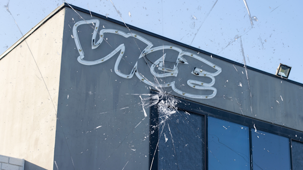 Vice building with cracking glass image overlain