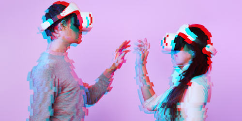 Two people wearing VR headsets connecting
