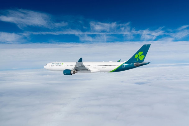Aer Lingus plane flying in the sky.