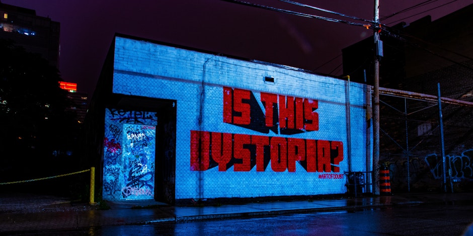 Graffiti that reads "Is this dystopia"