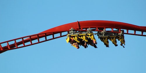 A rollercoaster, in corkscrew, currently upside-down