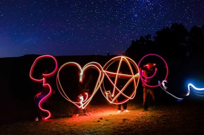 Long-exposure light art, in the shape of a balloon, a heart and other shapes