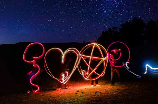 Long-exposure light art, in the shape of a balloon, a heart and other shapes