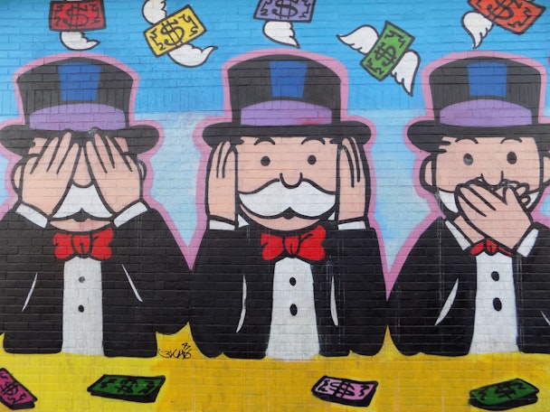 Rich Uncle Pennybags from Monopoly in the 'see no evil, speak no evil, hear no evil' positions