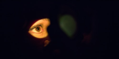 An eye, in a shaft of light