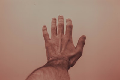 A man's hand reaching out