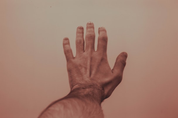 A man's hand reaching out