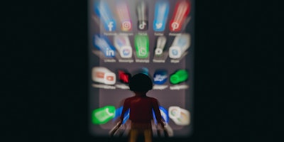 A lego man in front of a phone, showing a wall of apps, in a dreadful blur