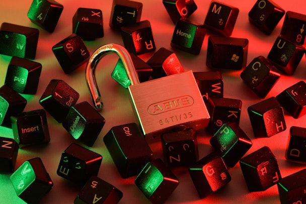 A padlock surrounded by keyboard keys