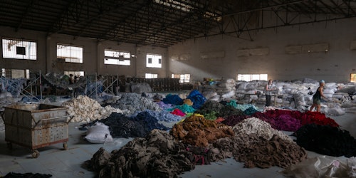 Piles of clothes in an abandoned factory