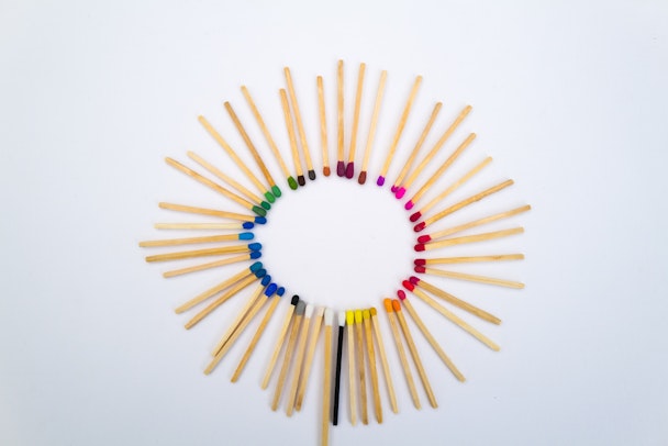 A circle of matches, with a variety of colored tips