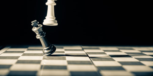 A chess game: white queen beats black king