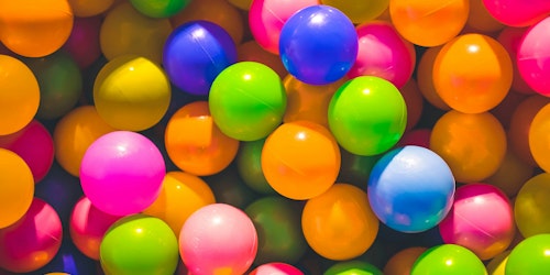 Brightly colored balls, as in a ball pit