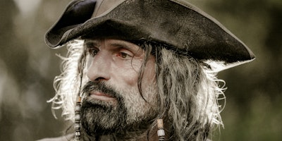 A man's face. He looks like a pirate!