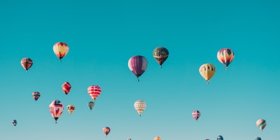 A sky filled with colorful hot air balloons
