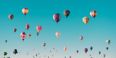 A sky filled with colorful hot air balloons