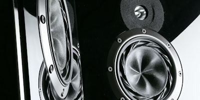 A black-and-white abstract of audio speakers