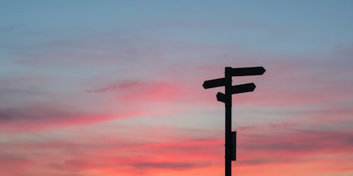 A signpost at sunset