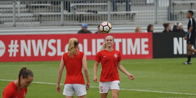 Two women playing football