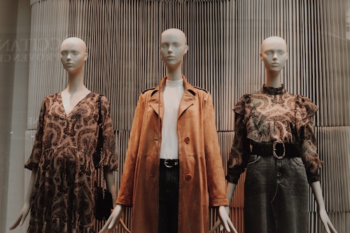 3 mannequins wearing clothes