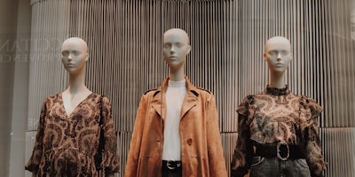 3 mannequins wearing clothes