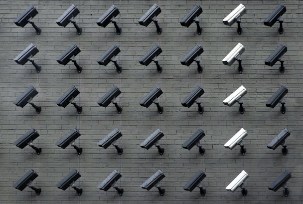 A wall of CCTV cameras