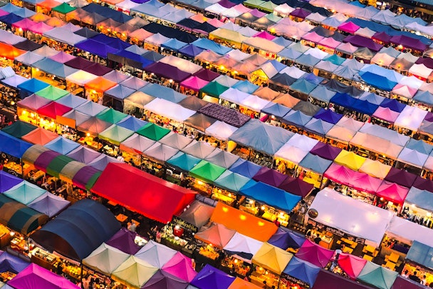 A covered market with colorful tents