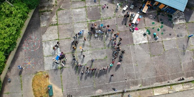 A circle of people, viewed from above
