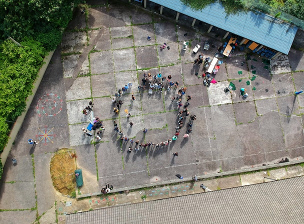 A circle of people, viewed from above