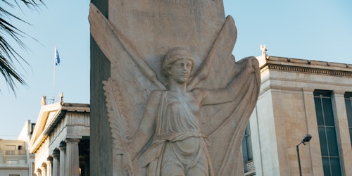 An ancient Greek statue of a winged god