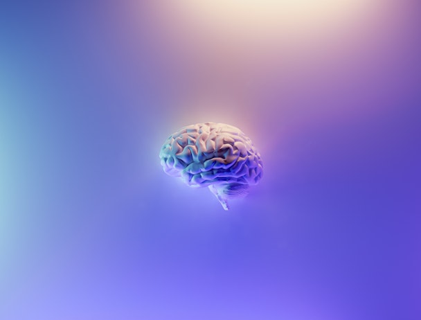 A purple-hued depiction of a glowing brain