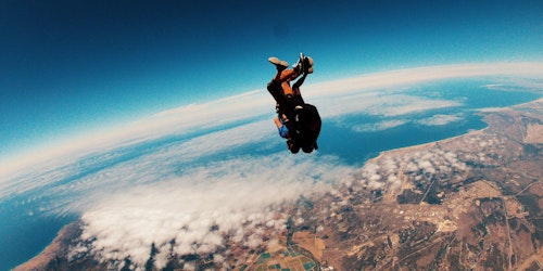 A skydiver, falling to earth