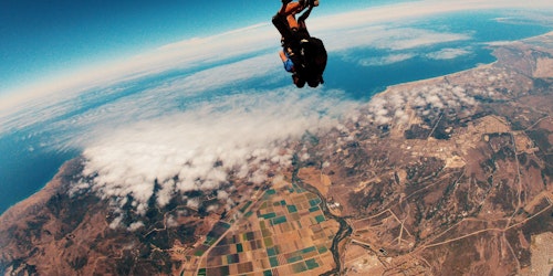 A skydiver, falling to earth