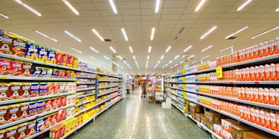 A brightly lit aisle in a supermarket