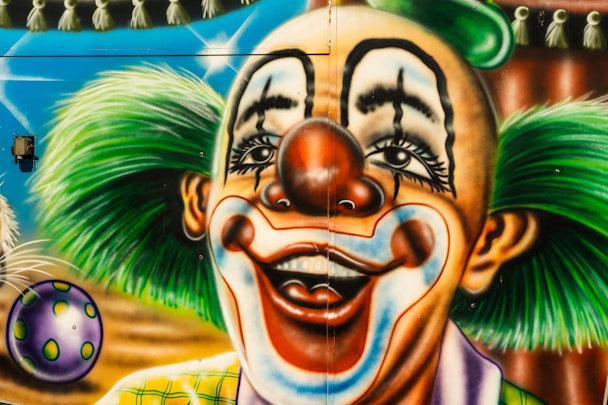 A giant multi-color mural of a clown