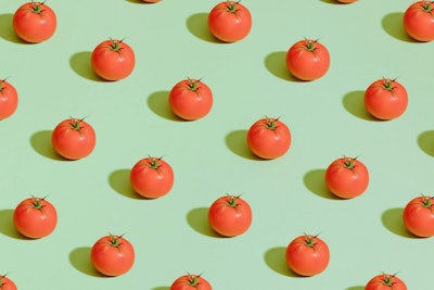 A grid of tomatoes on a colorful background