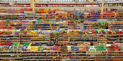 Busy, multicolored supermarket shelves seen from high up