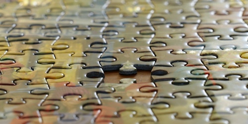 A jigsaw puzzle missing one piece
