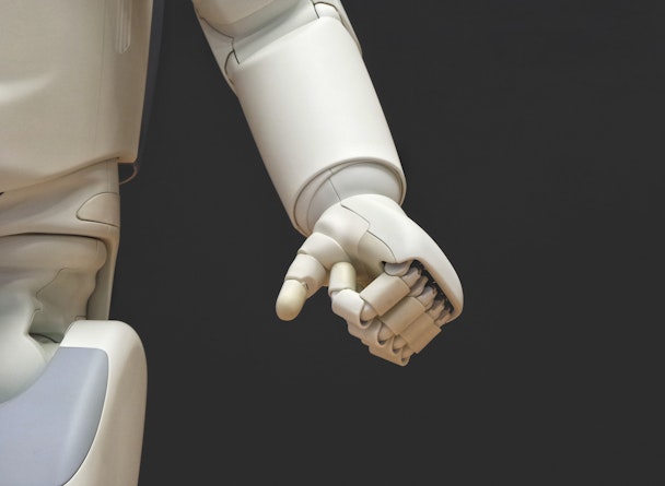 A robot hand, clenched into a fist